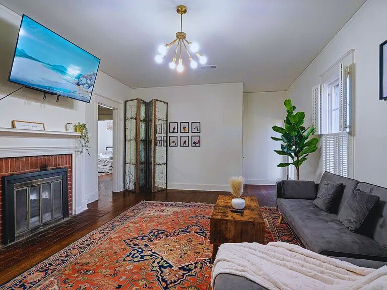 816 Charles Place Memphis, TN 38112 - Photo 12 of 24 a living room with furniture and a fireplace