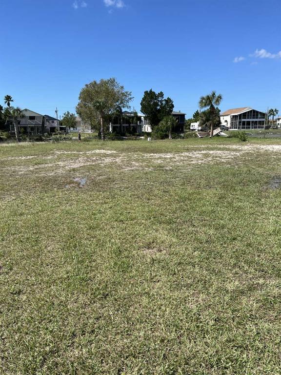 3341 Shoal Line Boulevard Hernando Beach, FL 34607 - Photo 6 of 9 a view of a field with an ocean