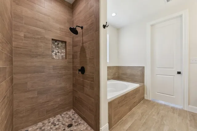 a bathroom with a bathtub and a sink