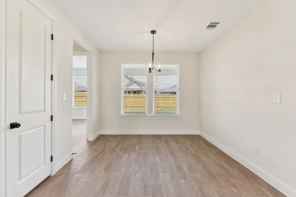 a kitchen with stainless steel appliances granite countertop a kitchen island a stove and a sink