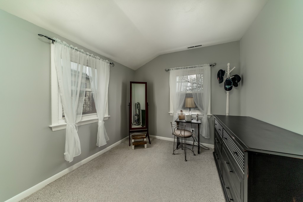 53 Colonial Road Weymouth, MA 02191 - Photo 15 of 19 a room that has a bed and a chair in it