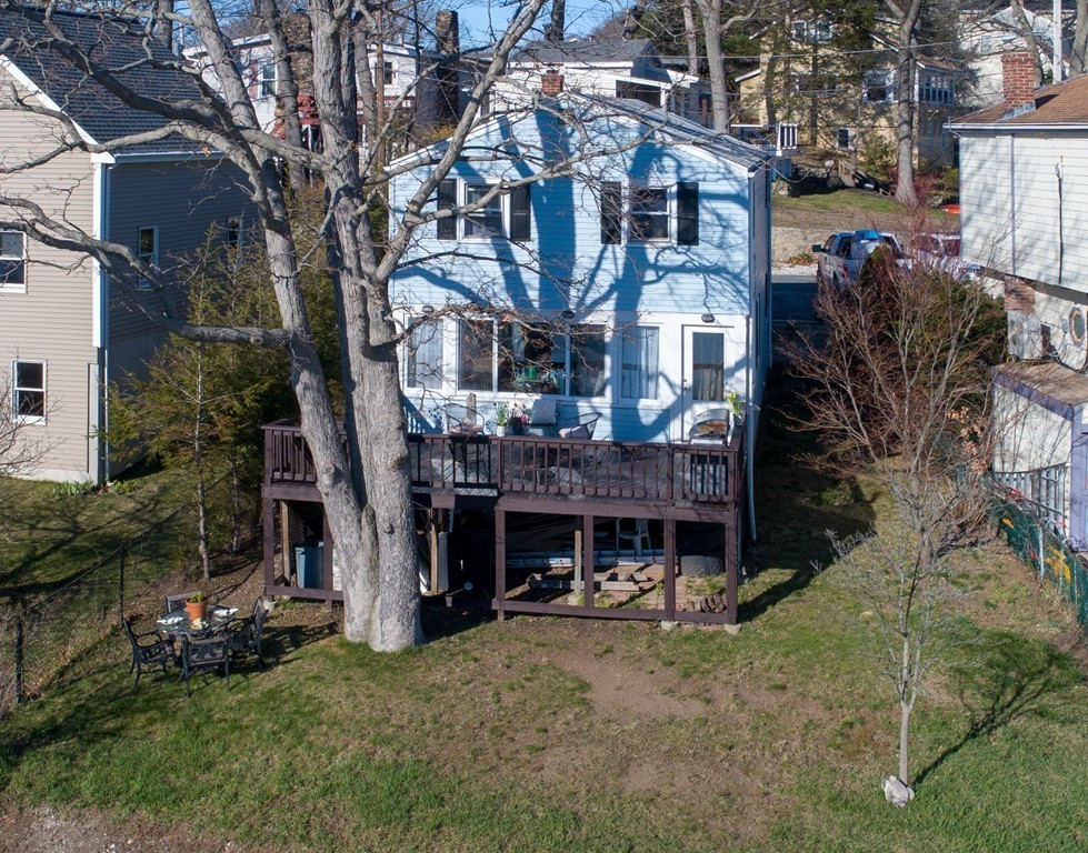 53 Colonial Road Weymouth, MA 02191 - Photo 17 of 19 a front view of a house with a yard