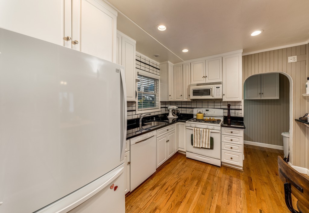 53 Colonial Road Weymouth, MA 02191 - Photo 6 of 19 a kitchen with stainless steel appliances a refrigerator sink and microwave