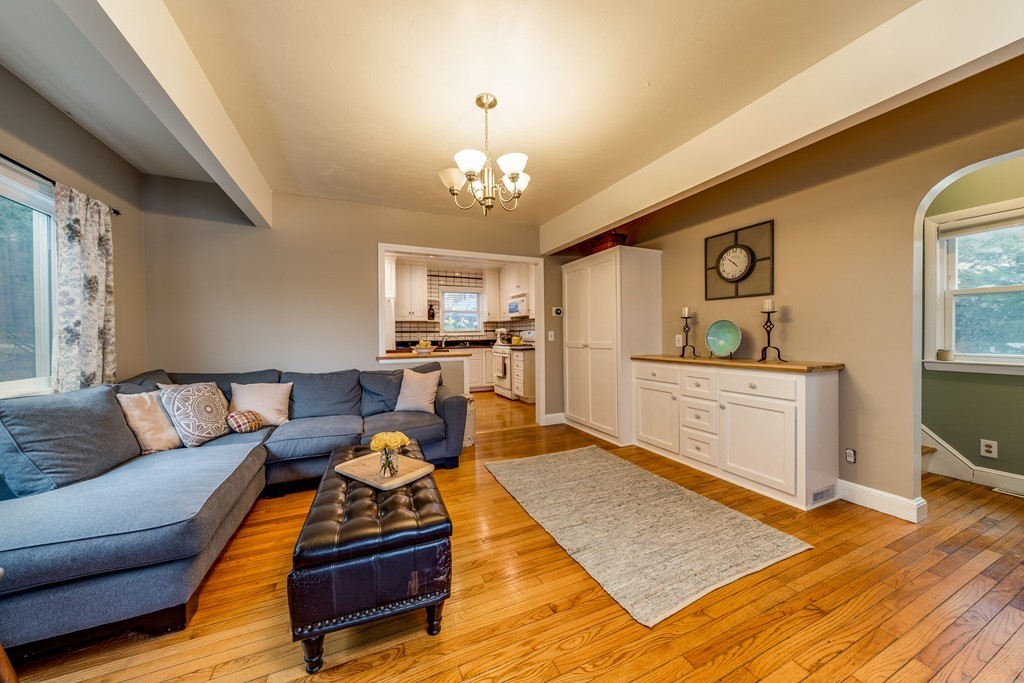 53 Colonial Road Weymouth, MA 02191 - Photo 7 of 19 a living room with furniture and a wooden floor