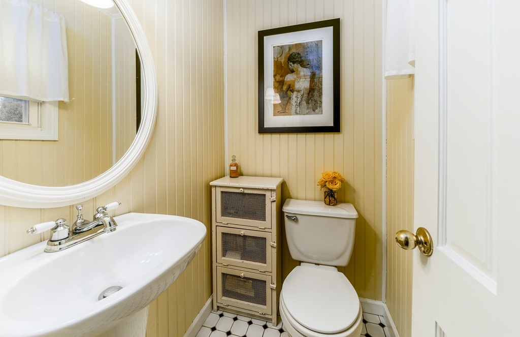 53 Colonial Road Weymouth, MA 02191 - Photo 8 of 19 a bathroom with a toilet sink and mirror