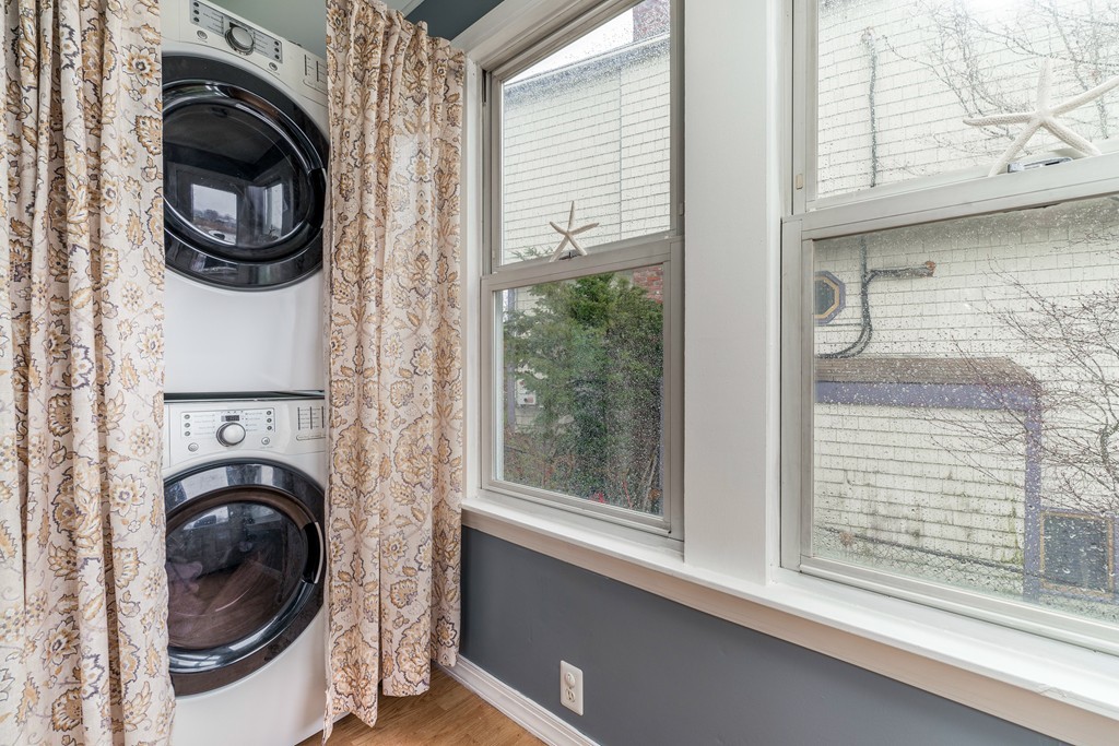 53 Colonial Road Weymouth, MA 02191 - Photo 9 of 19 a view of a hallway with washer and dryer