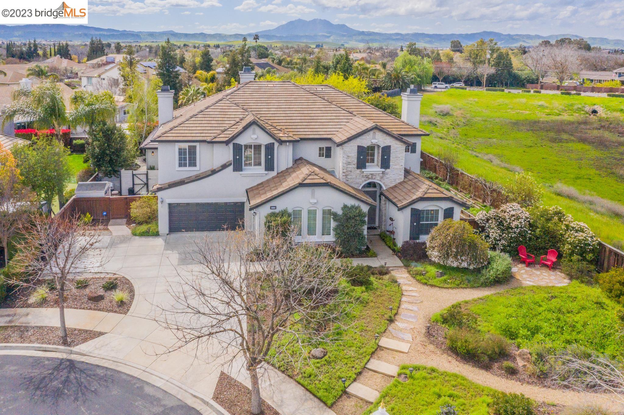 2249 Trinity Place Brentwood, CA 94513 - Photo 1 of 1 a aerial view of a house with a big yard and potted plants