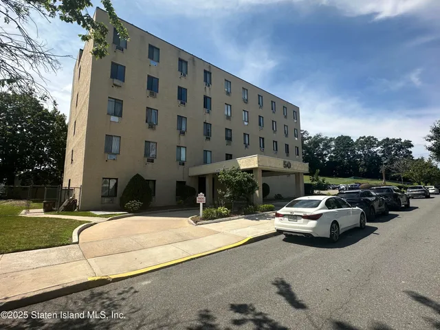 a view of street with parked cars