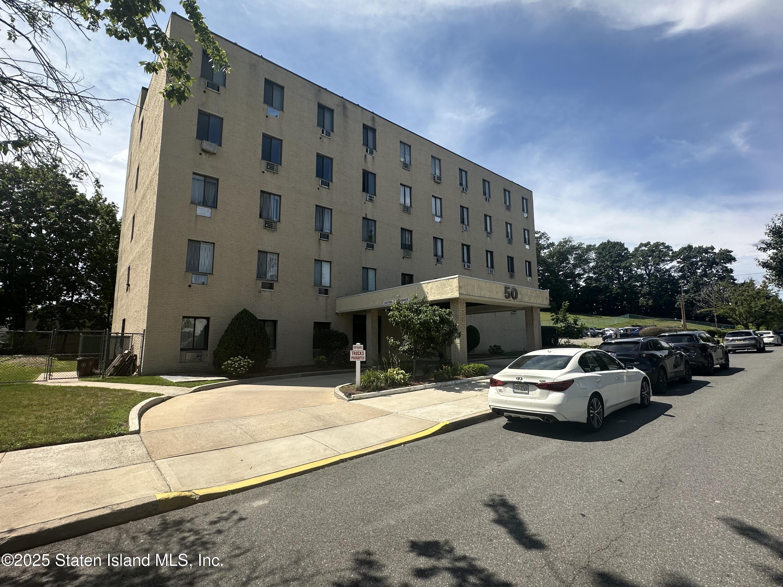 a view of street with parked cars
