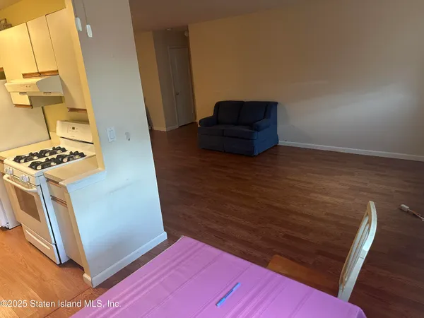 a view of livingroom with furniture and wooden floor