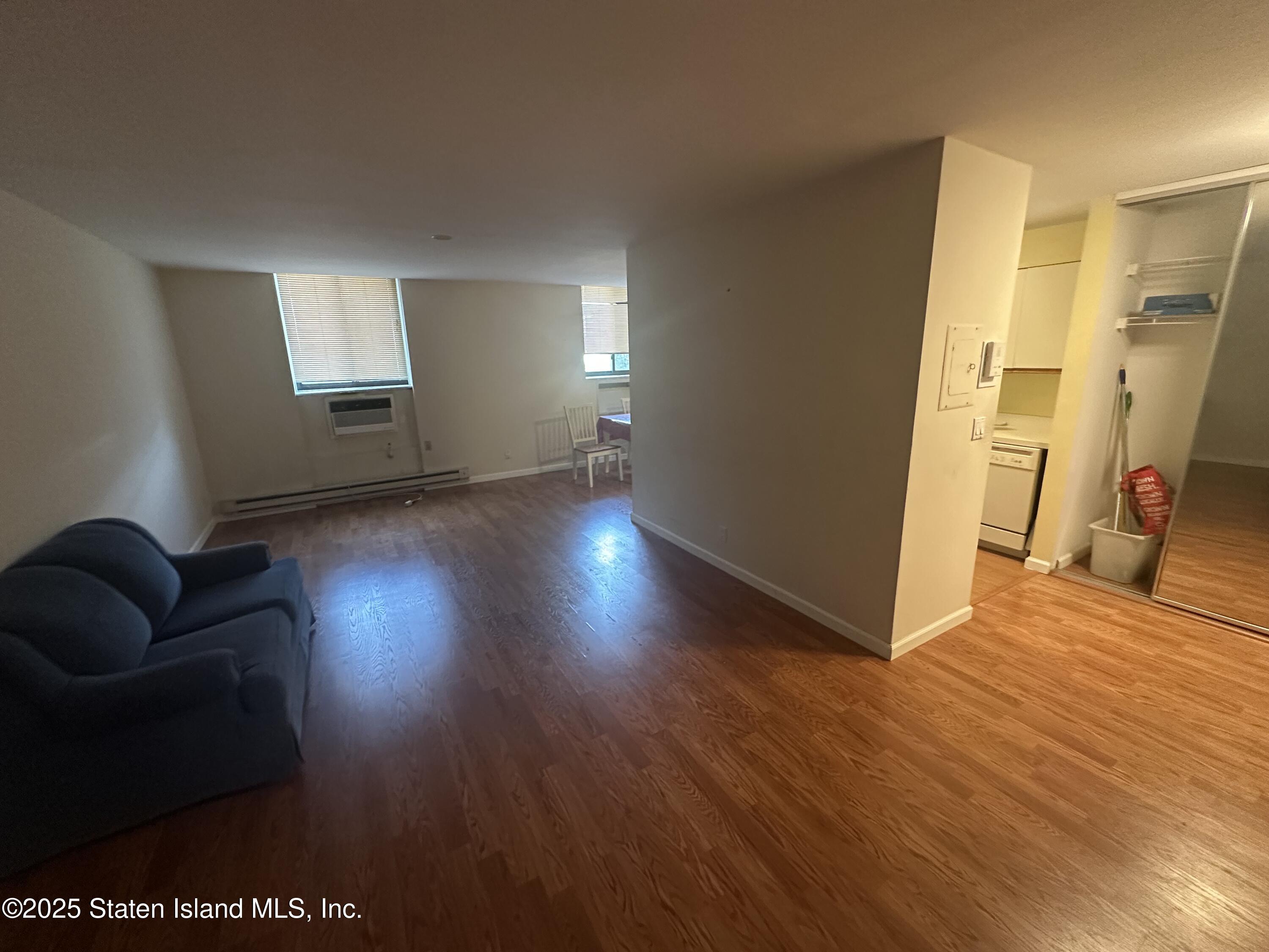 50 Belair Road, Unit 1E Staten Island, NY 10305 - Photo 7 of 12 a view of livingroom with furniture and wooden floor