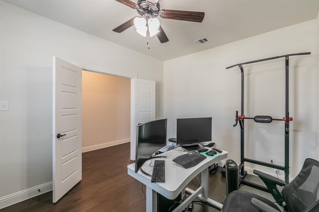 3424 Cimarron River Drive Prosper, TX 75078 - Photo 11 of 40 a view of a workspace with furniture and a ceiling fan