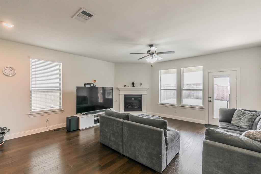 3424 Cimarron River Drive Prosper, TX 75078 - Photo 19 of 40 a living room with furniture fireplace and flat screen tv