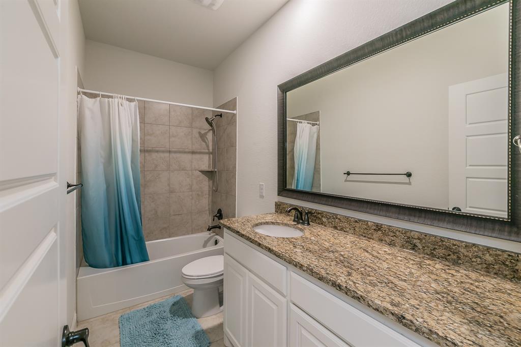 3424 Cimarron River Drive Prosper, TX 75078 - Photo 33 of 40 a bathroom with a granite countertop sink toilet and shower