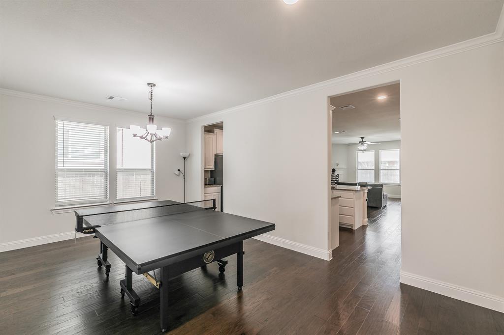 3424 Cimarron River Drive Prosper, TX 75078 - Photo 37 of 40 a view of a kitchen and dining room