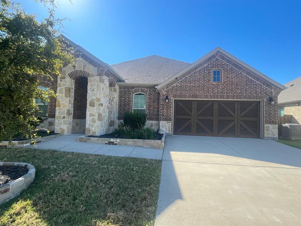 3424 Cimarron River Drive Prosper, TX 75078 - Photo 5 of 40 a front view of a house with garden