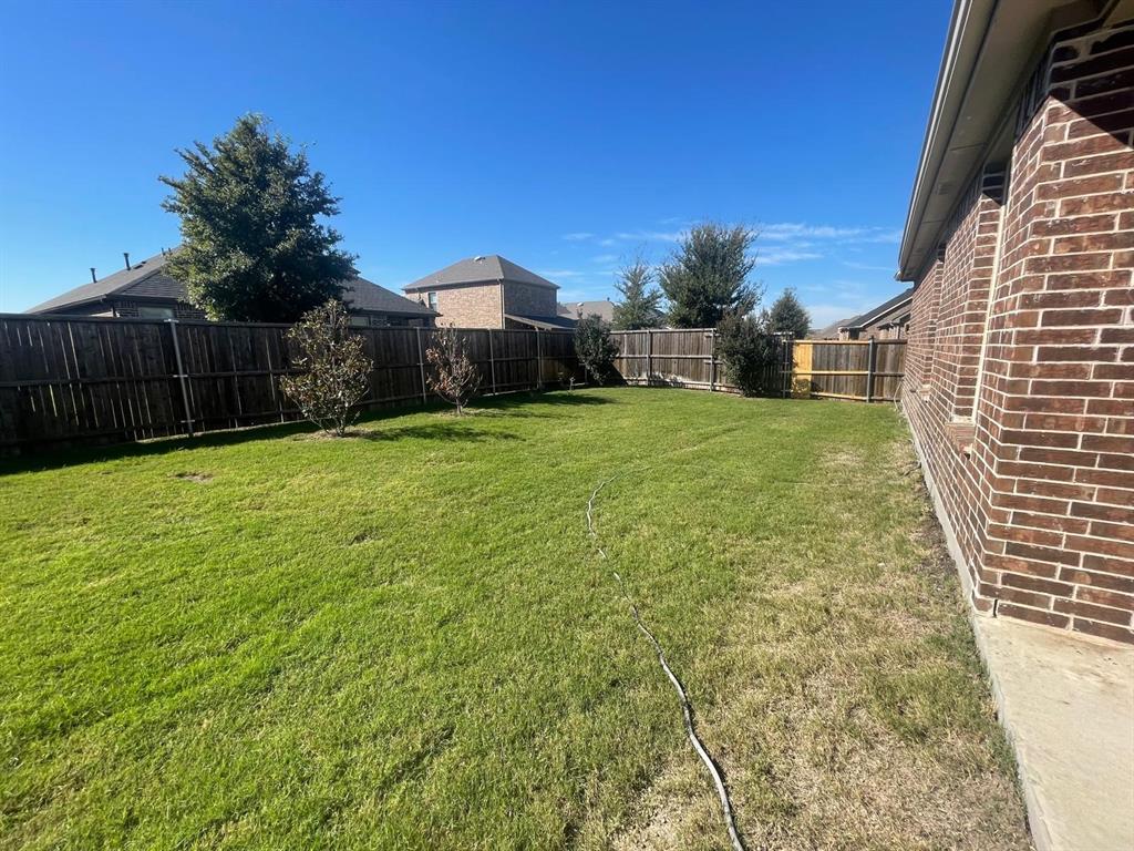 3424 Cimarron River Drive Prosper, TX 75078 - Photo 6 of 40 a view of a back yard of the house