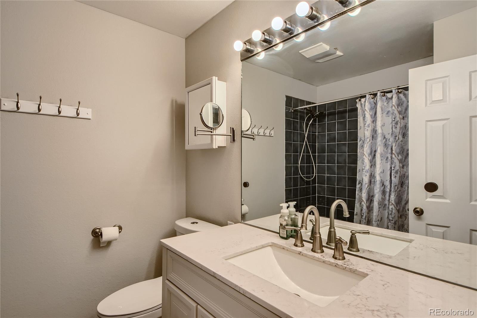 1500 Buckeye Circle Georgetown, CO 80444 - Photo 14 of 33 a bathroom with a sink vanity granite and toilet