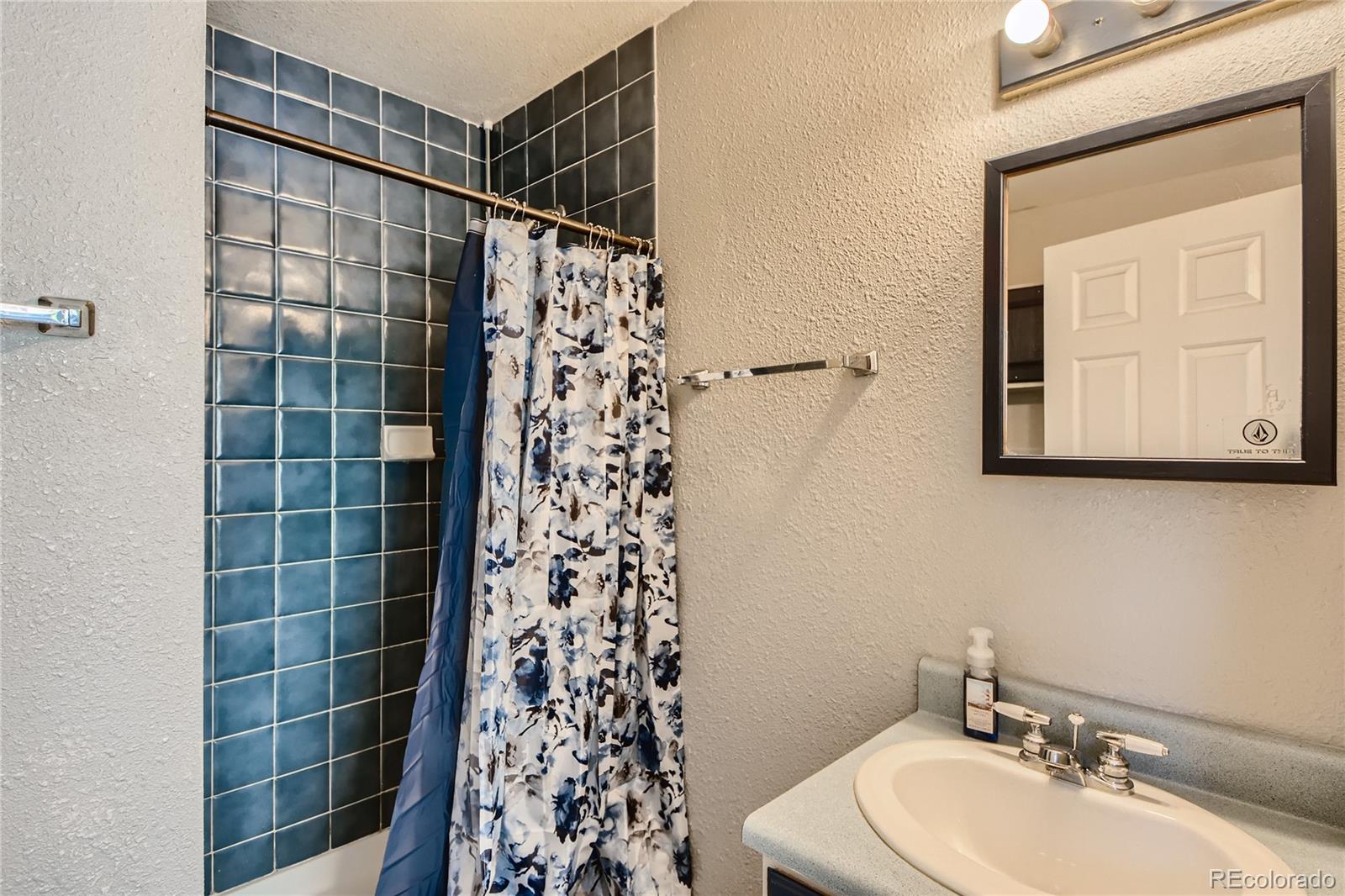 1500 Buckeye Circle Georgetown, CO 80444 - Photo 20 of 33 a bathroom with a sink toilet and shower