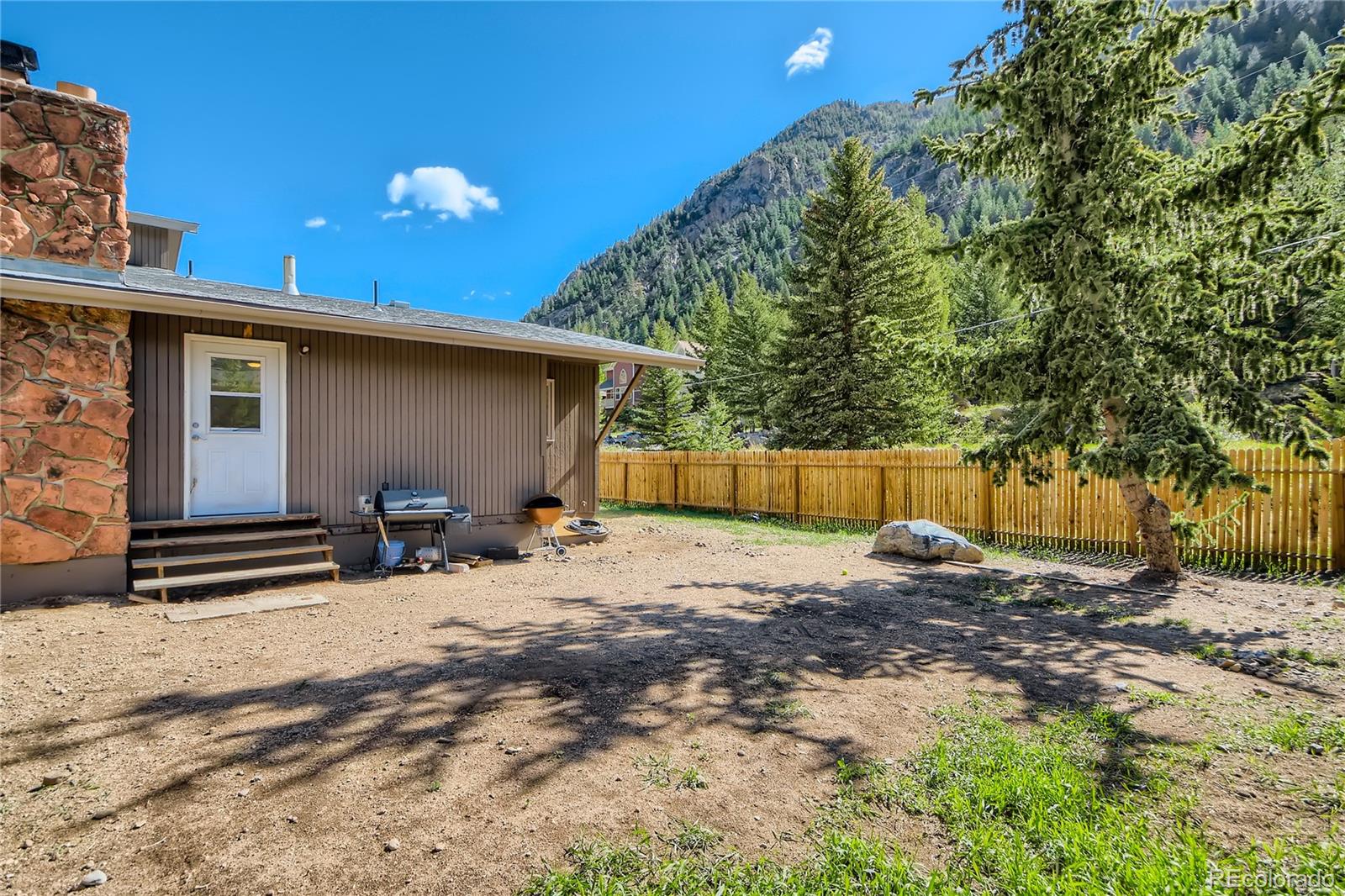 1500 Buckeye Circle Georgetown, CO 80444 - Photo 24 of 33 a backyard of a house with shaded area
