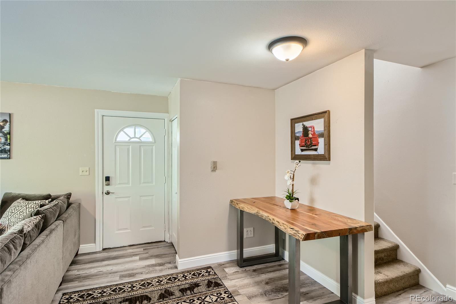 1500 Buckeye Circle Georgetown, CO 80444 - Photo 4 of 33 a view of a hallway to a livingroom with furniture