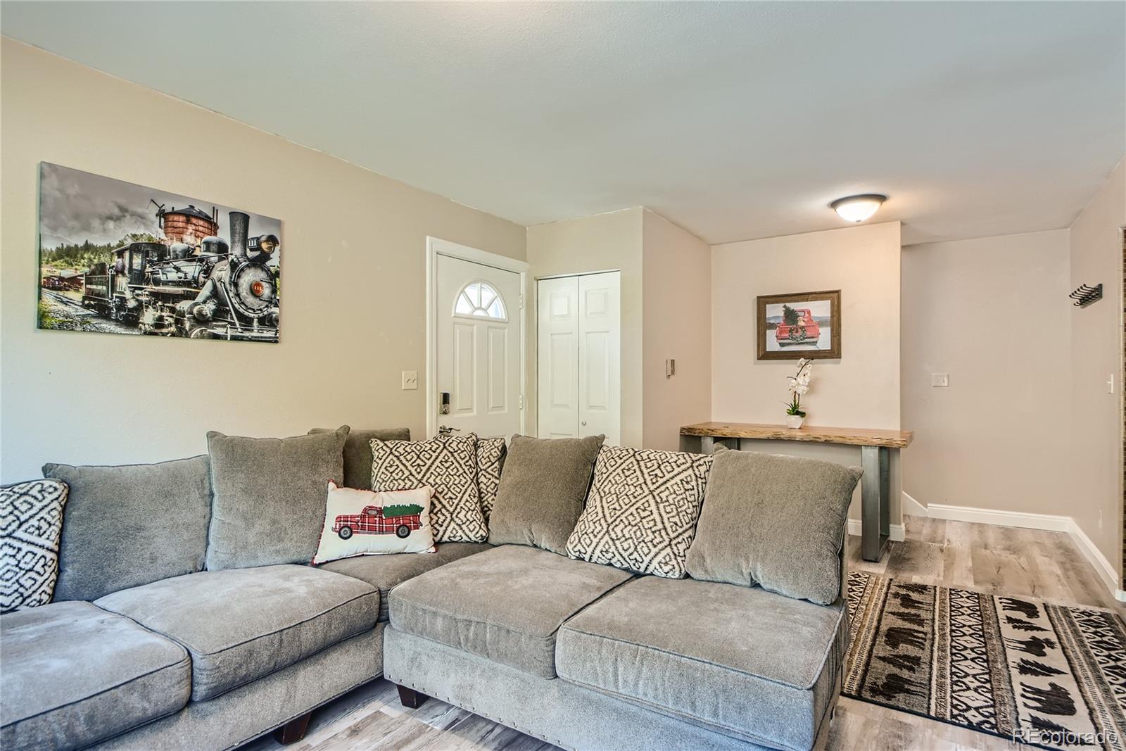 1500 Buckeye Circle Georgetown, CO 80444 - Photo 5 of 33 a living room with furniture and a rug