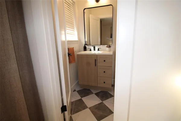 a bathroom with a shower and a mirror