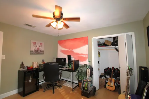 a room with gym equipment and a window