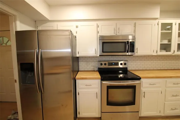 a kitchen with a sink cabinets and window
