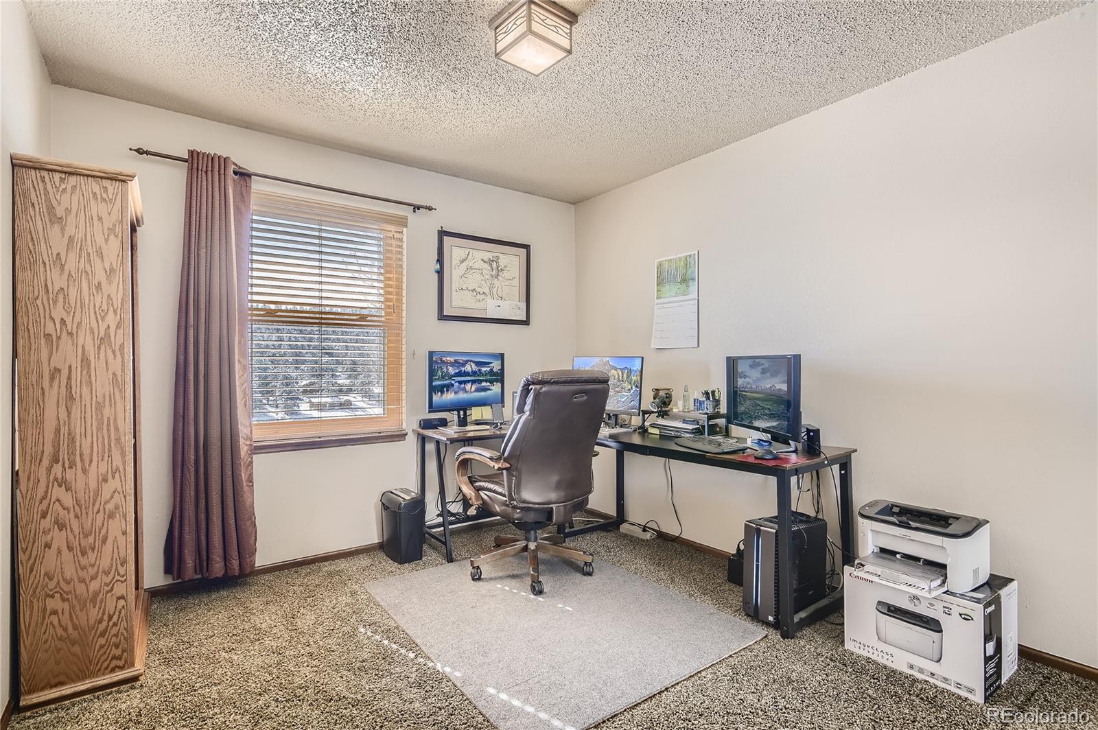 1749 County Road 72 Bailey, CO 80421 - Photo 16 of 35 a view of a workspace with furniture and a window