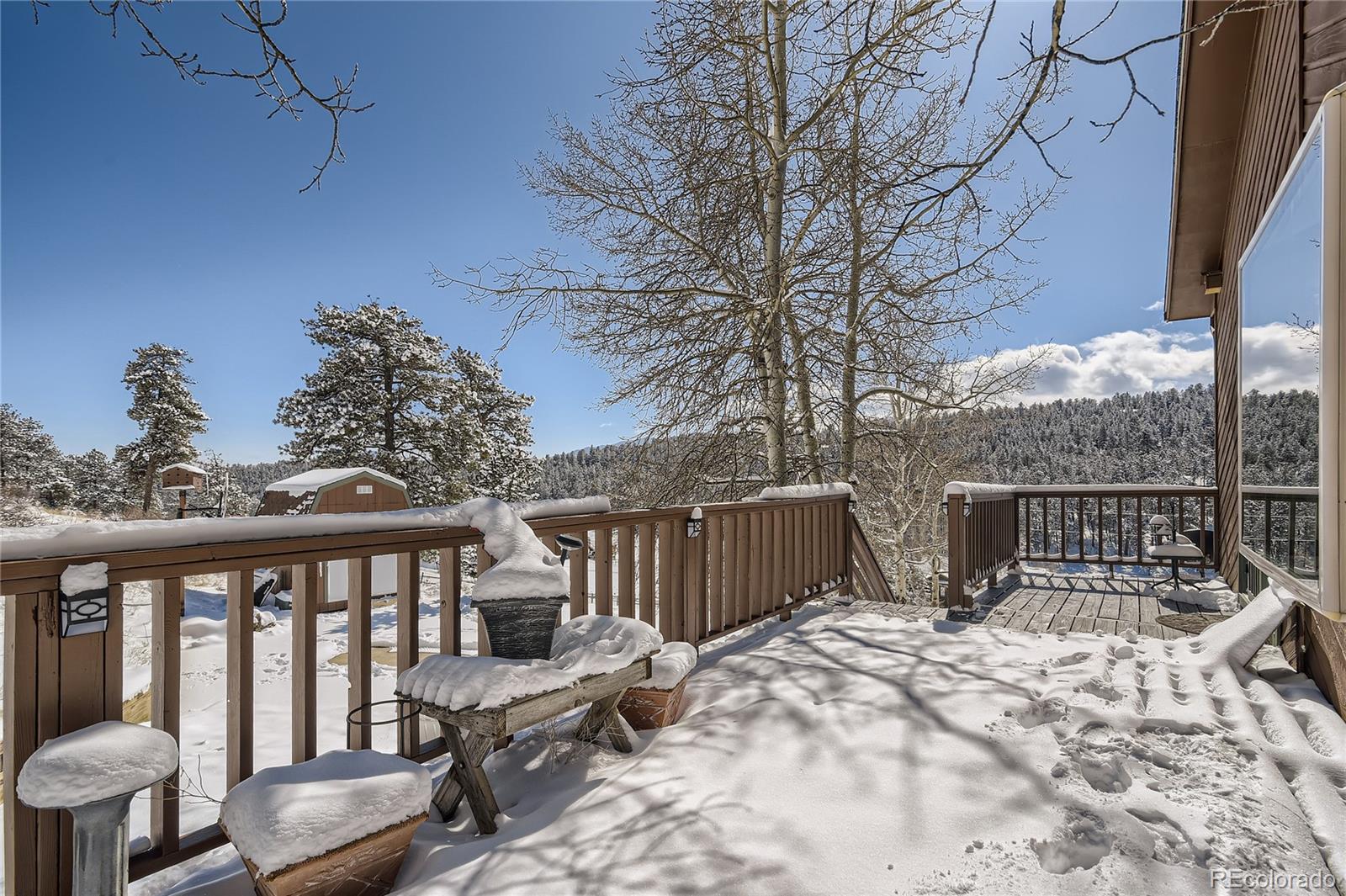 1749 County Road 72 Bailey, CO 80421 - Photo 23 of 35 a view of a balcony with chairs