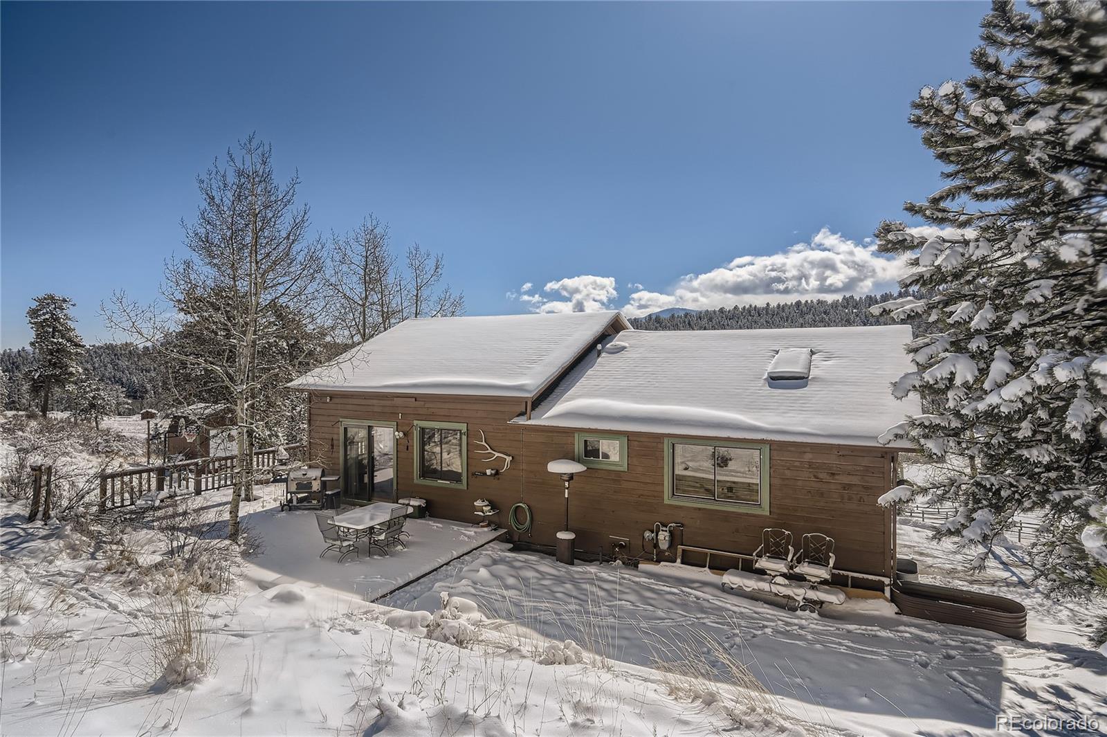 1749 County Road 72 Bailey, CO 80421 - Photo 25 of 35 a view of a house with a patio