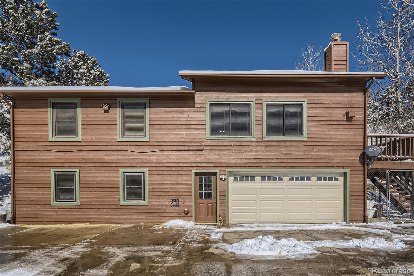 1749 County Road 72 Bailey, CO 80421 - Photo 31 of 35 a front view of a house with a yard