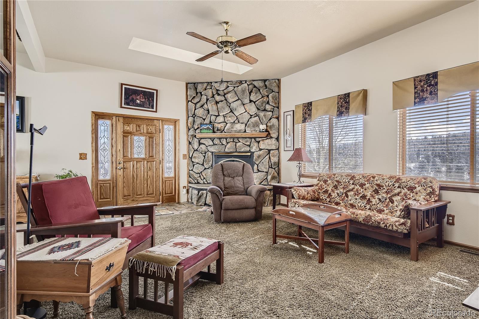 1749 County Road 72 Bailey, CO 80421 - Photo 6 of 35 a bedroom with furniture and a window