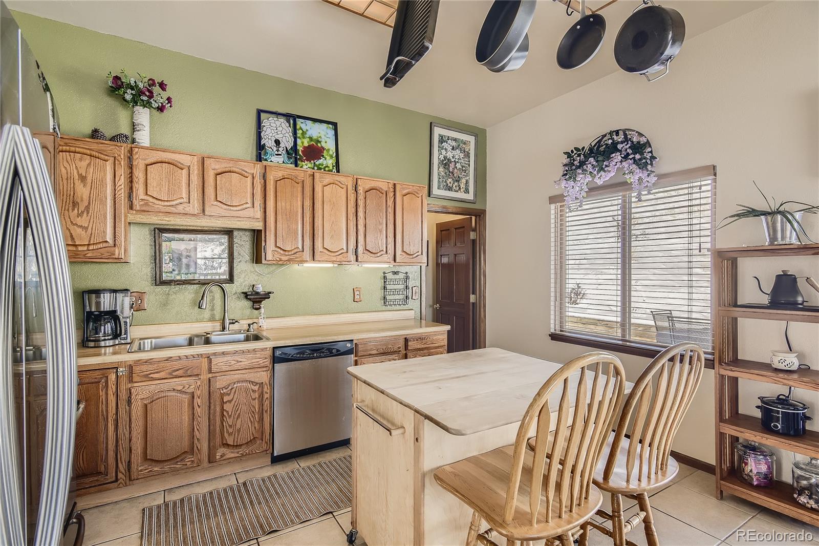 1749 County Road 72 Bailey, CO 80421 - Photo 10 of 35 a kitchen with stainless steel appliances granite countertop a sink and cabinets