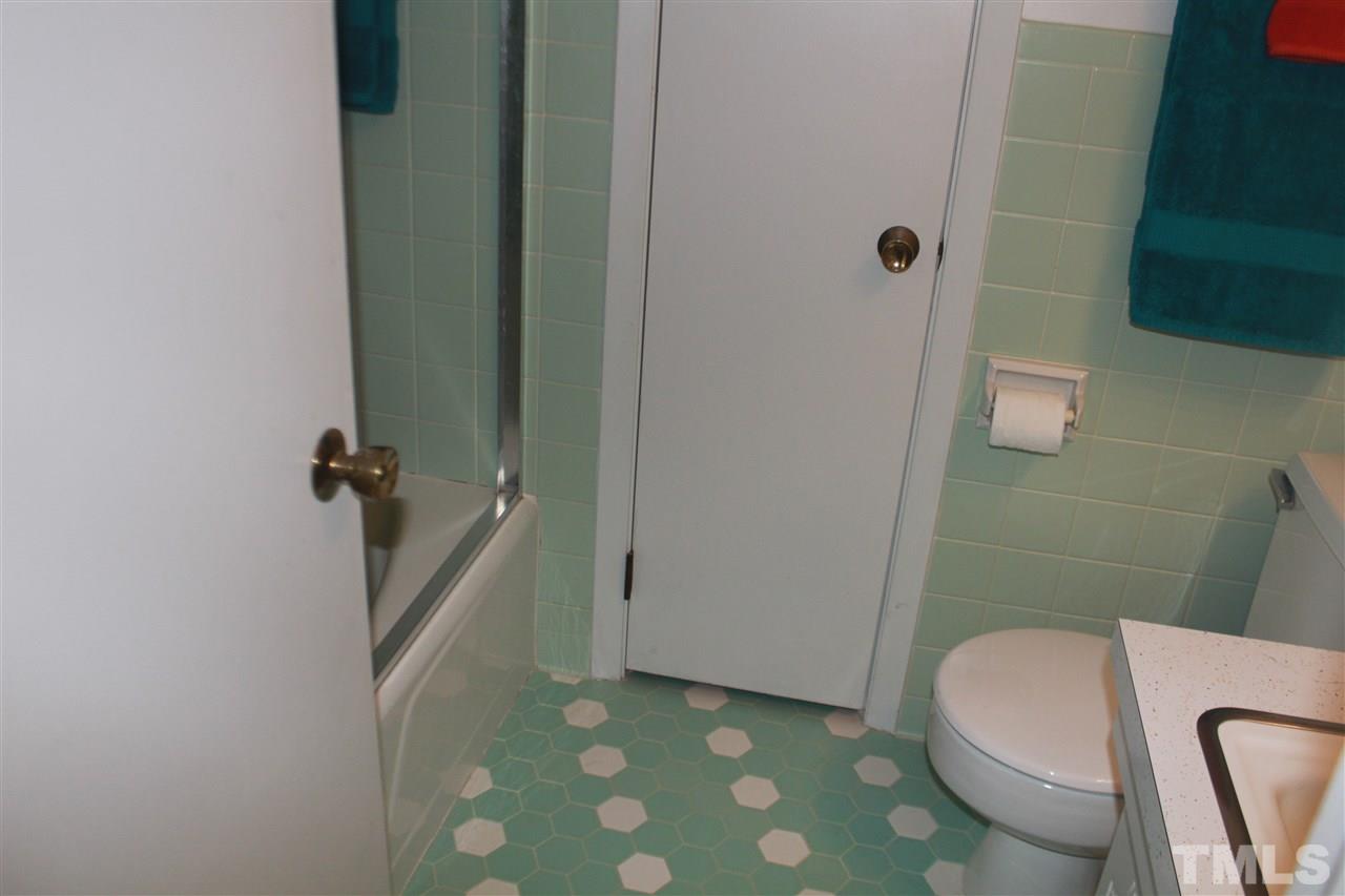 301 Northfield Drive Raleigh, NC 27609 - Photo 11 of 24 a white toilet sitting next to a shower