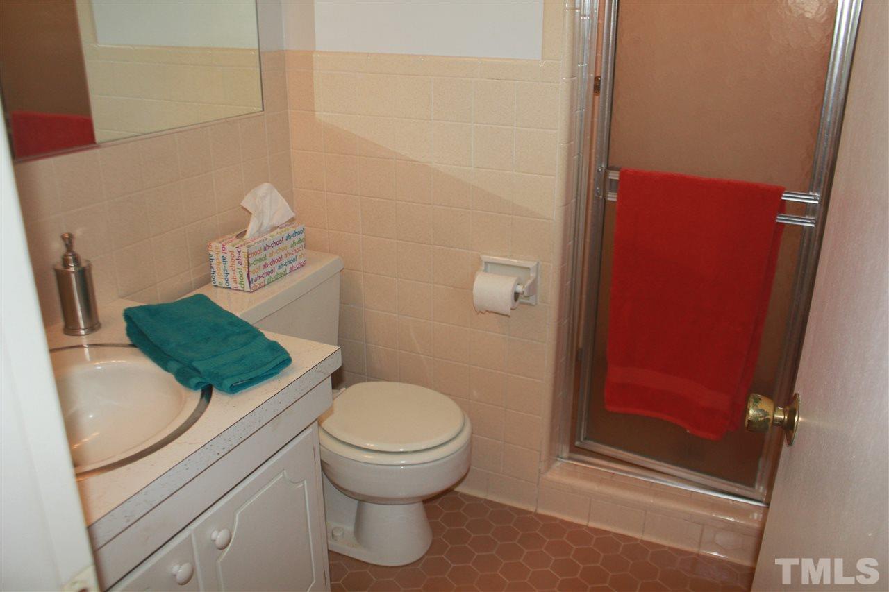 301 Northfield Drive Raleigh, NC 27609 - Photo 14 of 24 a bathroom with a sink and a toilet