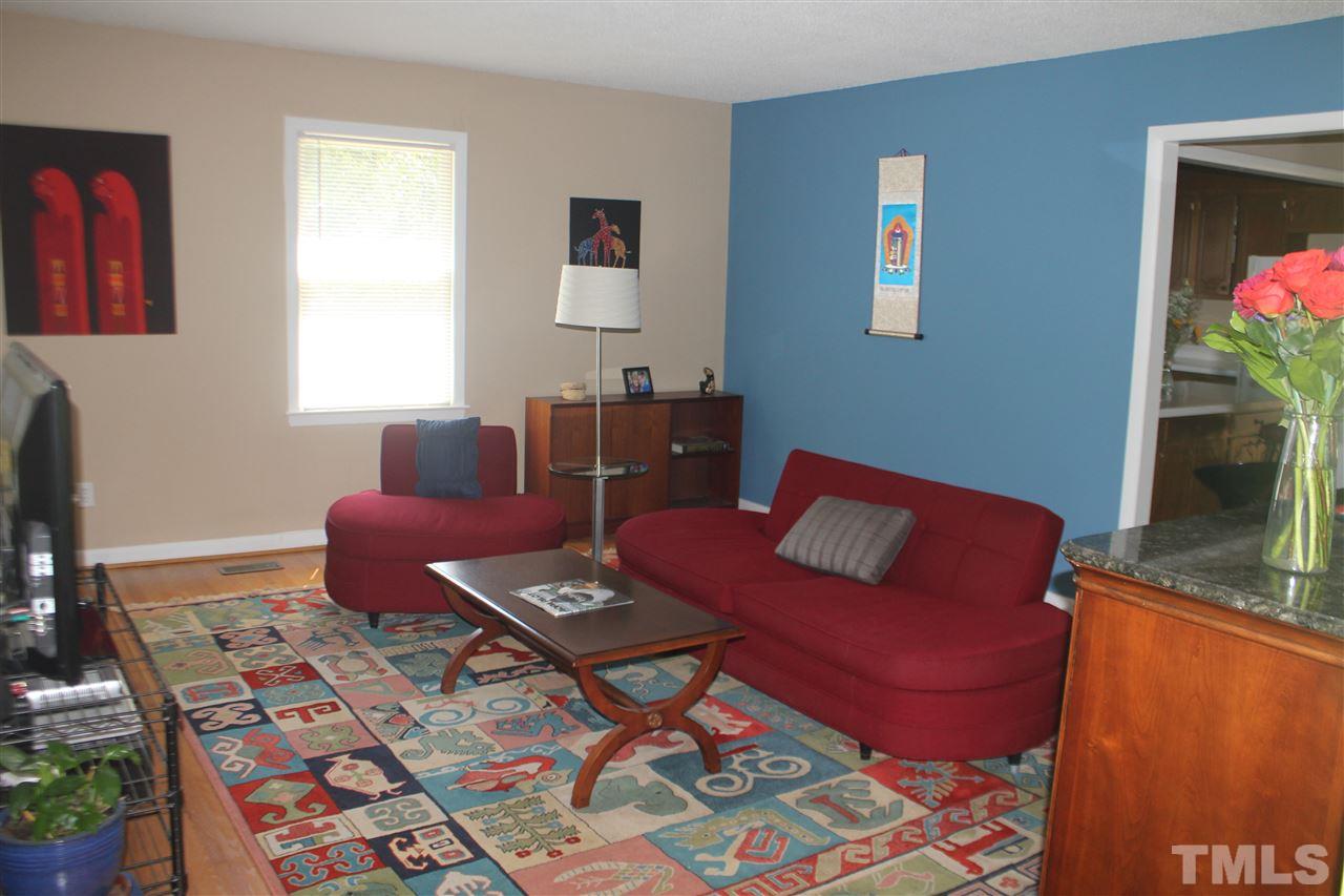 301 Northfield Drive Raleigh, NC 27609 - Photo 3 of 24 a living room with furniture and a potted plant