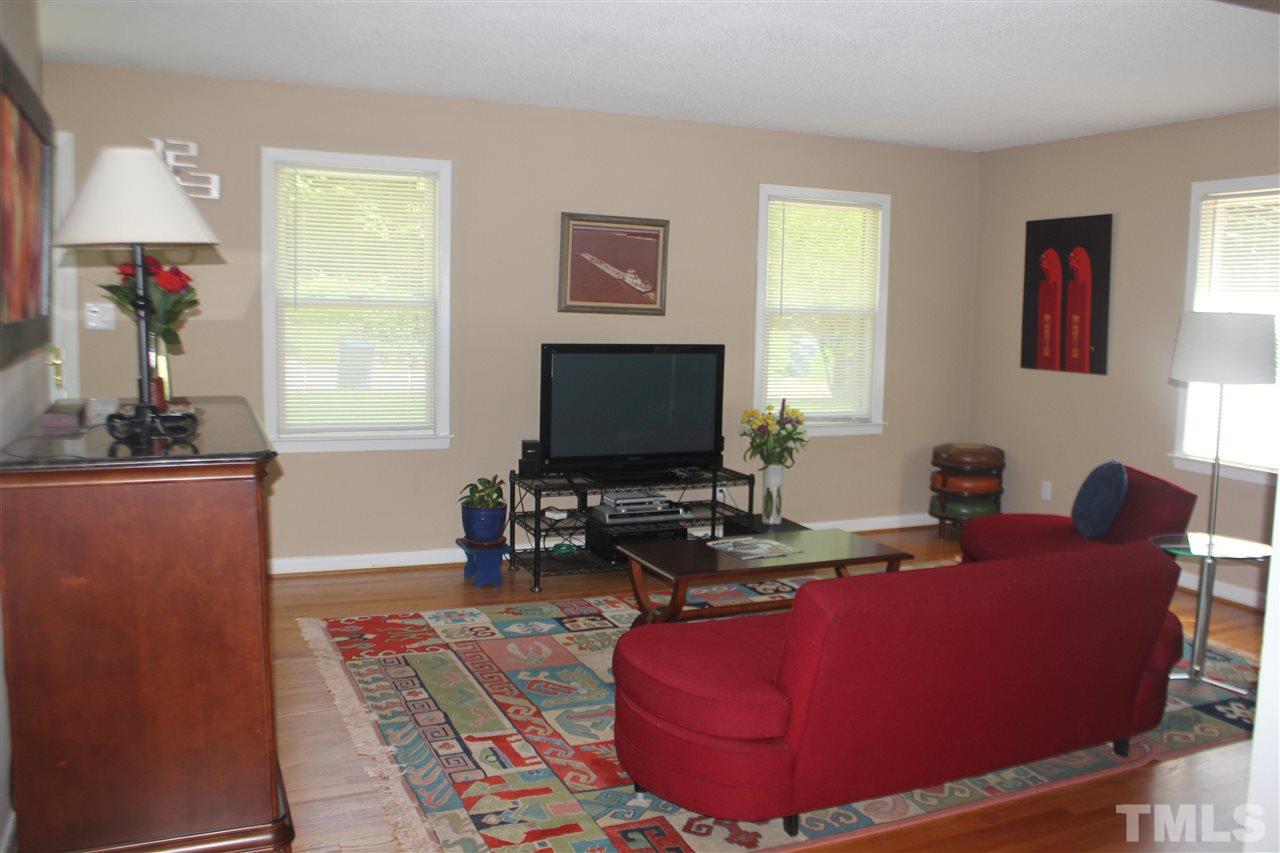 301 Northfield Drive Raleigh, NC 27609 - Photo 4 of 24 a living room with furniture and a flat screen tv