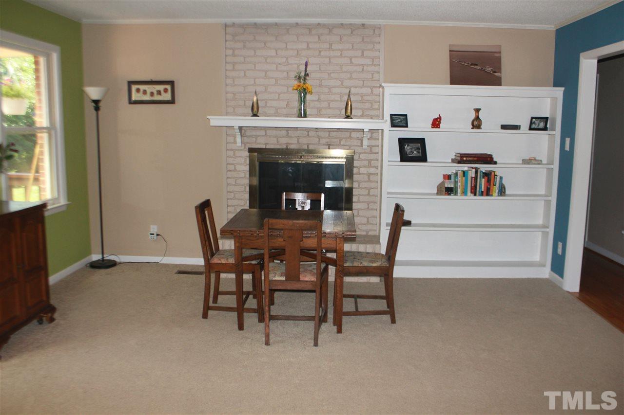 301 Northfield Drive Raleigh, NC 27609 - Photo 7 of 24 a living room with furniture and a fireplace
