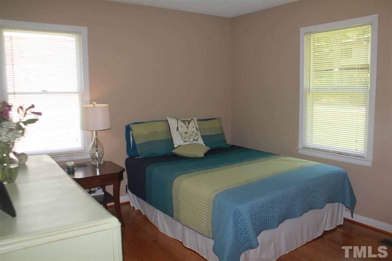 301 Northfield Drive Raleigh, NC 27609 - Photo 9 of 24 a bedroom with a bed and window