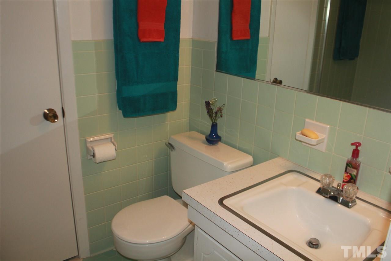 301 Northfield Drive Raleigh, NC 27609 - Photo 10 of 24 a bathroom with a sink and a toilet