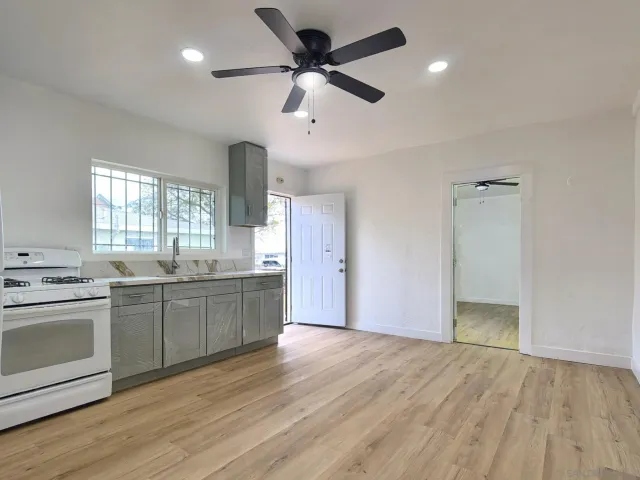 a kitchen with a stove and a sink