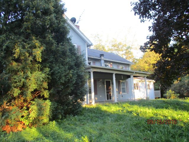 2697 North Unity Road Lena, IL 61048 - Photo 16 of 16 a view of a house with backyard and garden