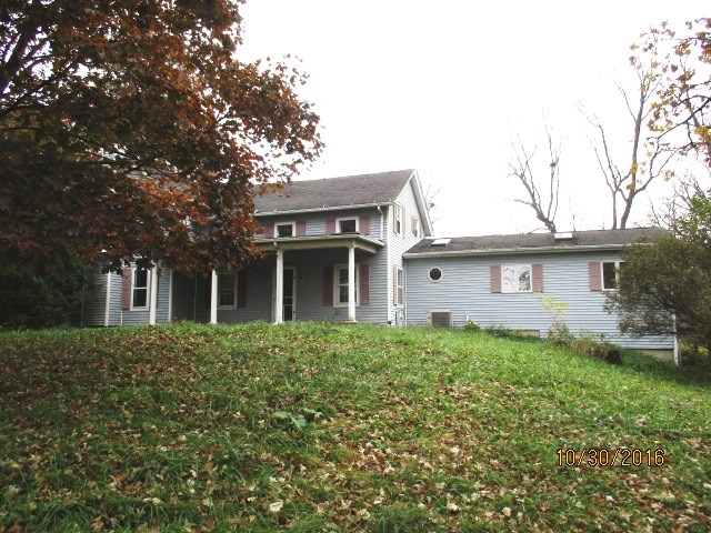 2697 North Unity Road Lena, IL 61048 - Photo 2 of 16 a view of a house with a big yard and large tree