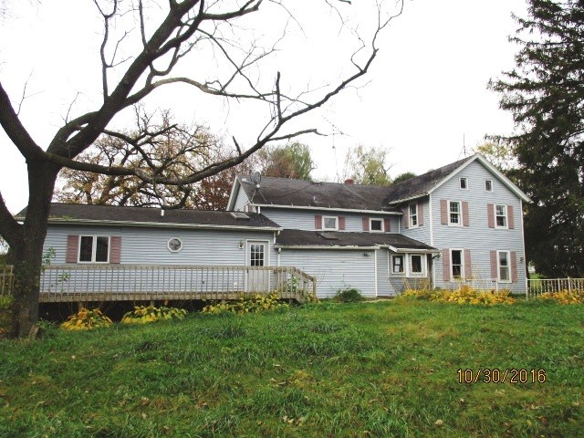 2697 North Unity Road Lena, IL 61048 - Photo 6 of 16 a view of a house with a yard and a tree