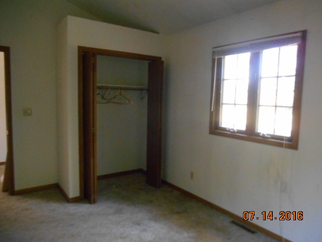 2697 North Unity Road Lena, IL 61048 - Photo 8 of 16 an empty room with a window