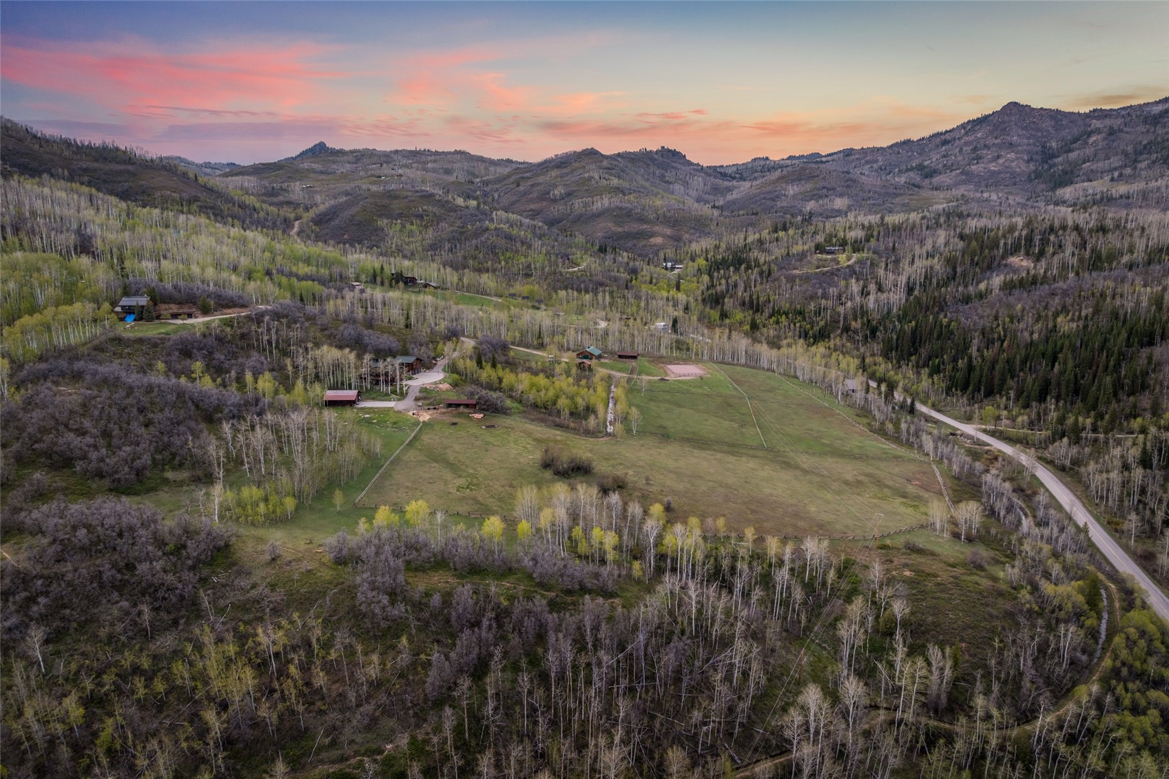 31775 Bradley Ranch Steamboat Springs, CO 80487 - Photo 6 of 49 a view of a lush green hillside and a houses