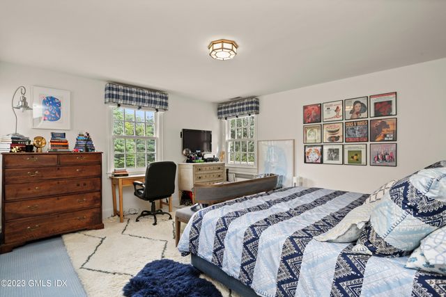 a bedroom with a bed and furniture