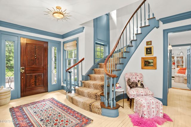 a living room with furniture and a rug